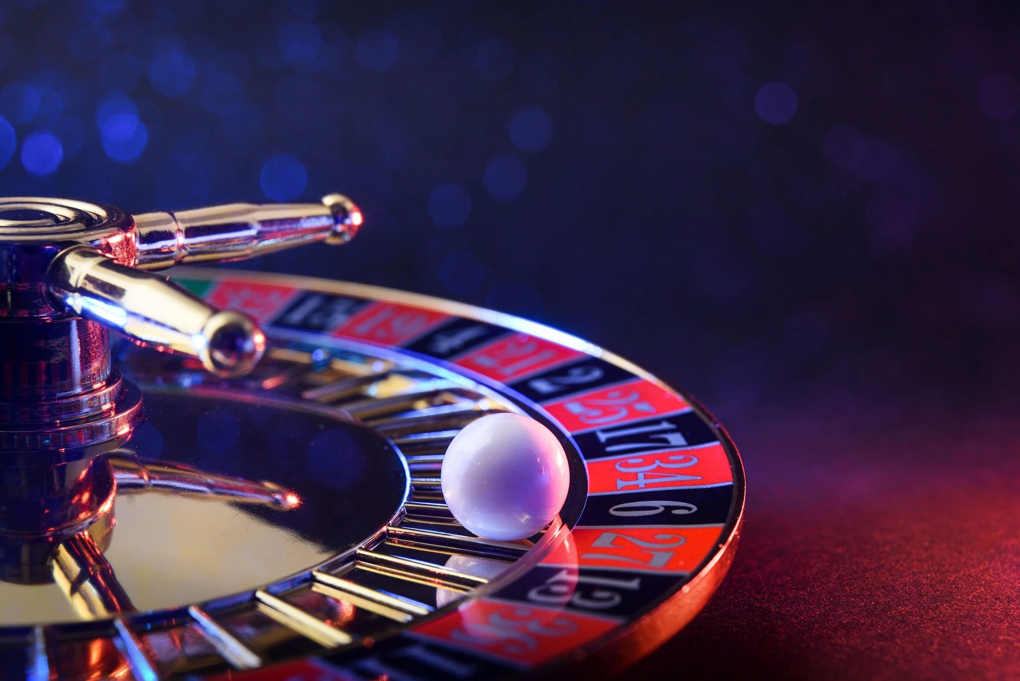 Closeup of a white ball on a gambling table.